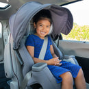 Load image into gallery viewer, A child is sitting in the Baby Trend Cover Me 4-in-1 Convertible Car Seat