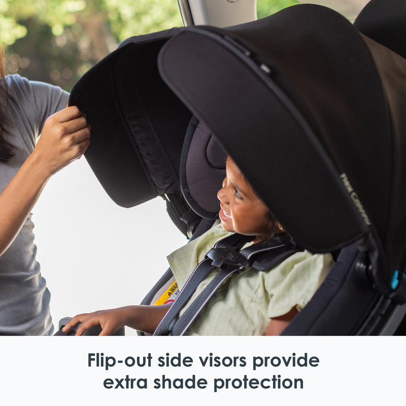 Flip-out side visors provide extra shade protection from the Baby Trend Cover Me 4-in-1 Convertible Car Seat
