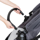 Load image into gallery viewer, Baby Trend Sonar Switch 6-in-1 Modular Stroller bumper bar on the seat