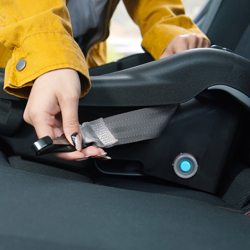 A mom is installing the Baby Trend EZ-Lift PLUS Infant Car Seat base with LATCH